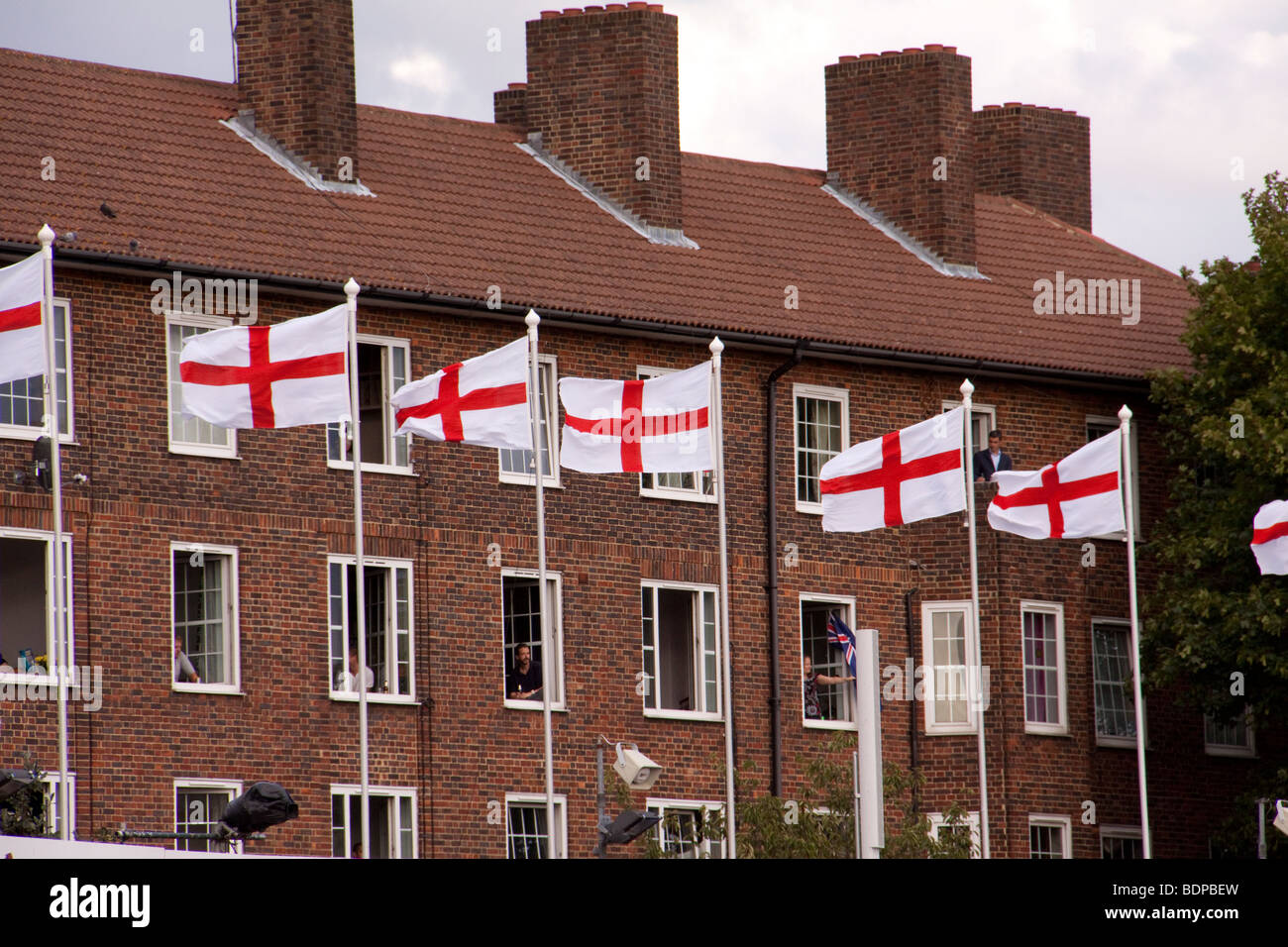 St George's flags outside apartment building Stock Photo