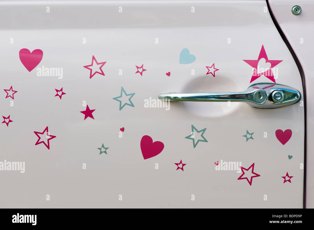 Pink Austin Mini door with pink stars and love hearts Stock Photo