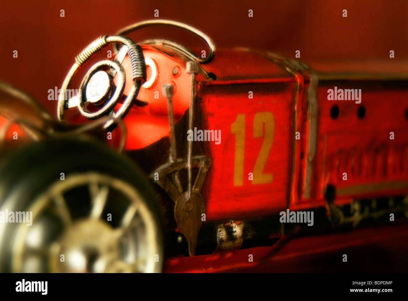 Old fashioned tin metal car toy Stock Photo Alamy