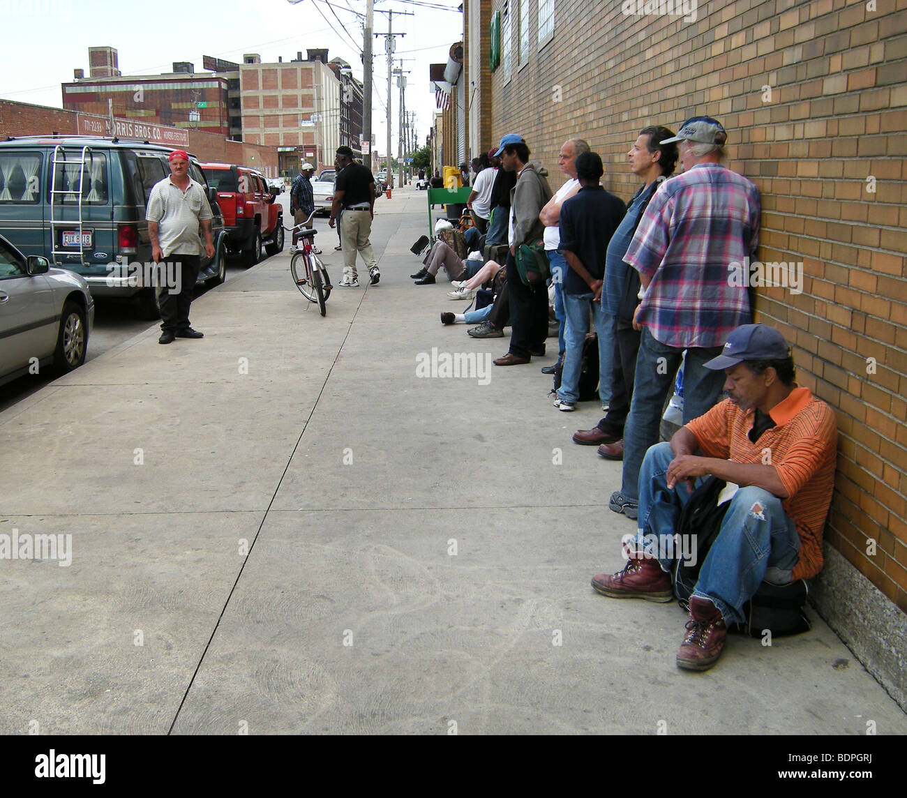 people waiting at entrance of men's shelter, Cleveland, OH Stock Photo