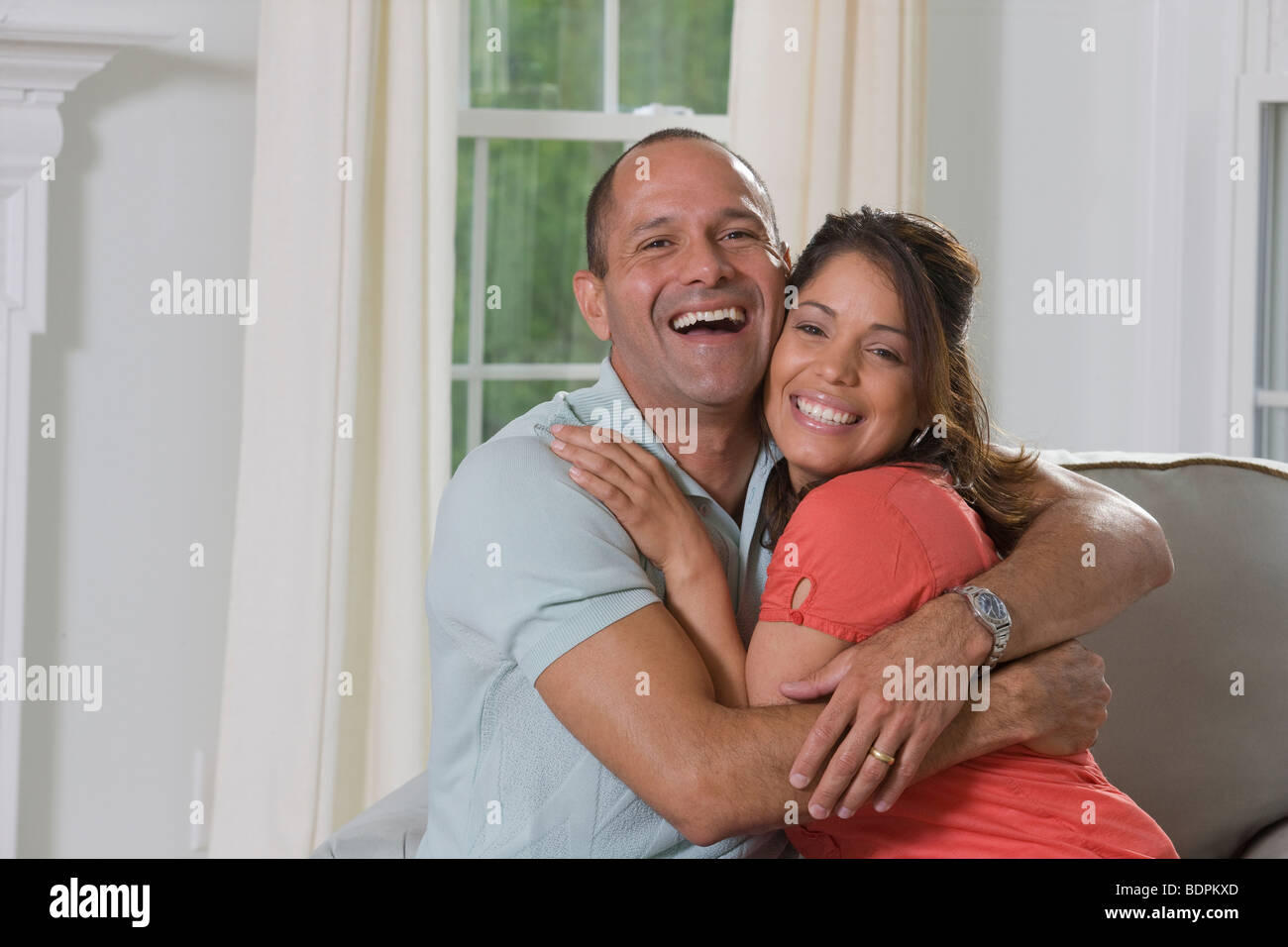 Portrait of a Hispanic couple smiling Stock Photo - Alamy