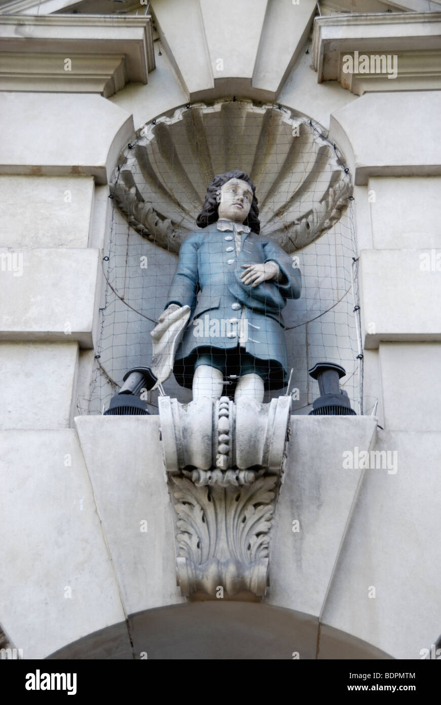 Statue of male Blue Coat pupil on exterior of Sir John Cass's Foundation Primary School in Aldgate, London, England, UK. Stock Photo