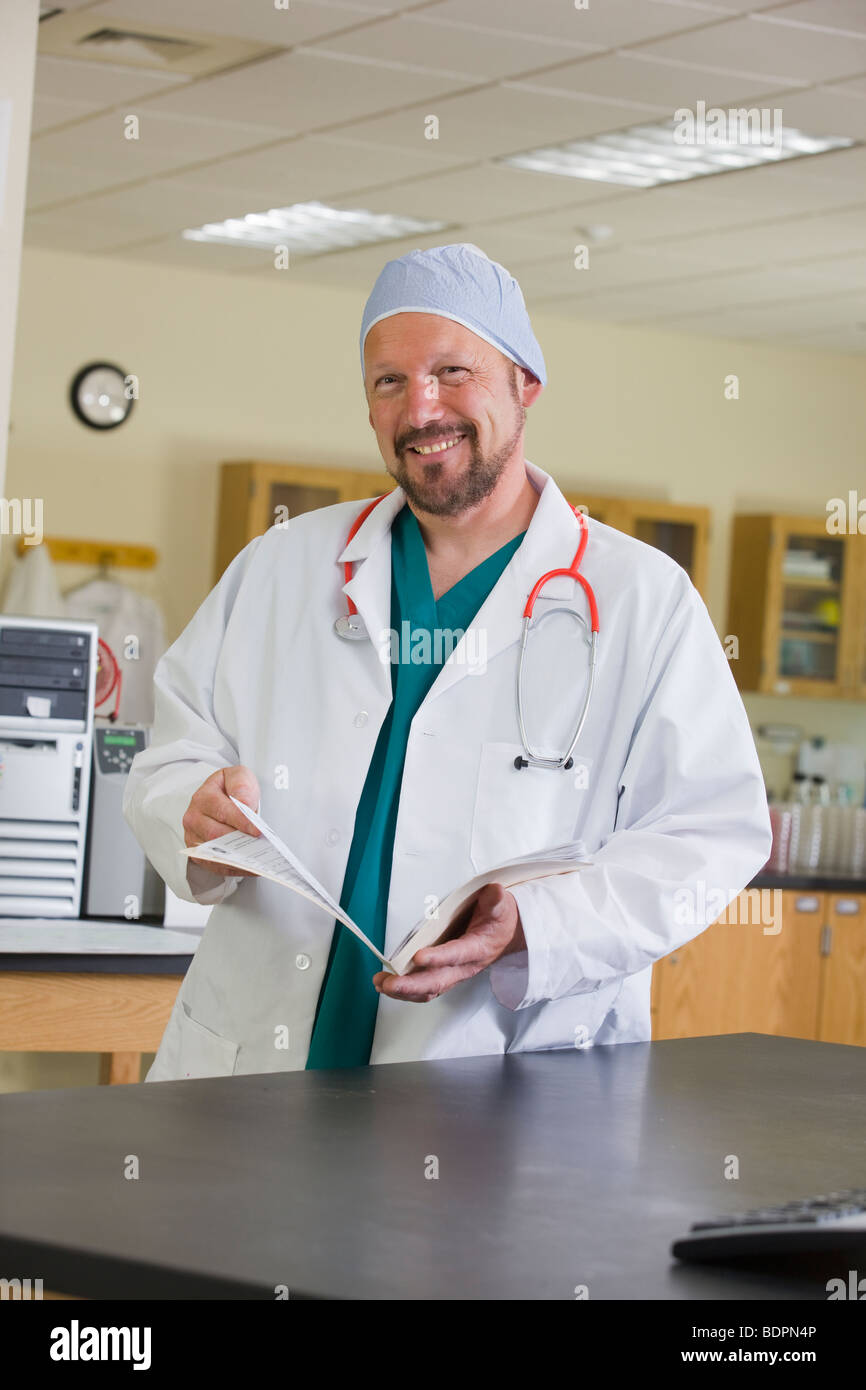 Portrait of a male doctor smiling Stock Photo - Alamy