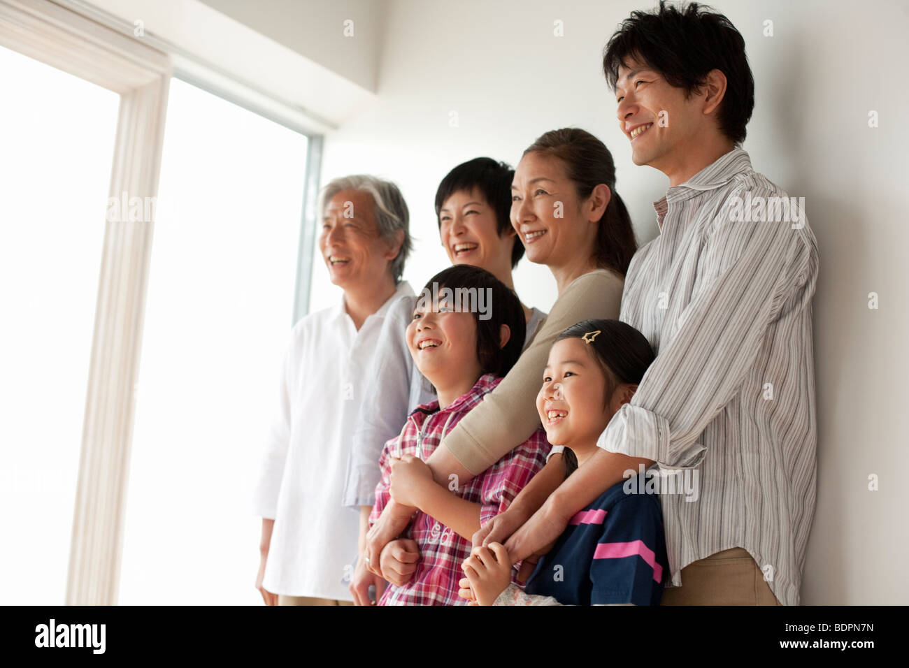 Multi generation family smiling Stock Photo