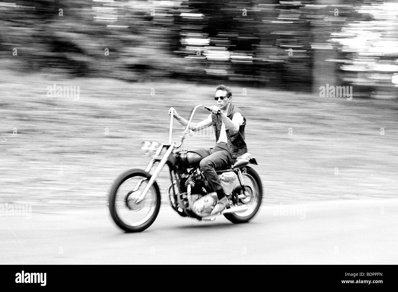A man riding a motorcycle Stock Photo - Alamy