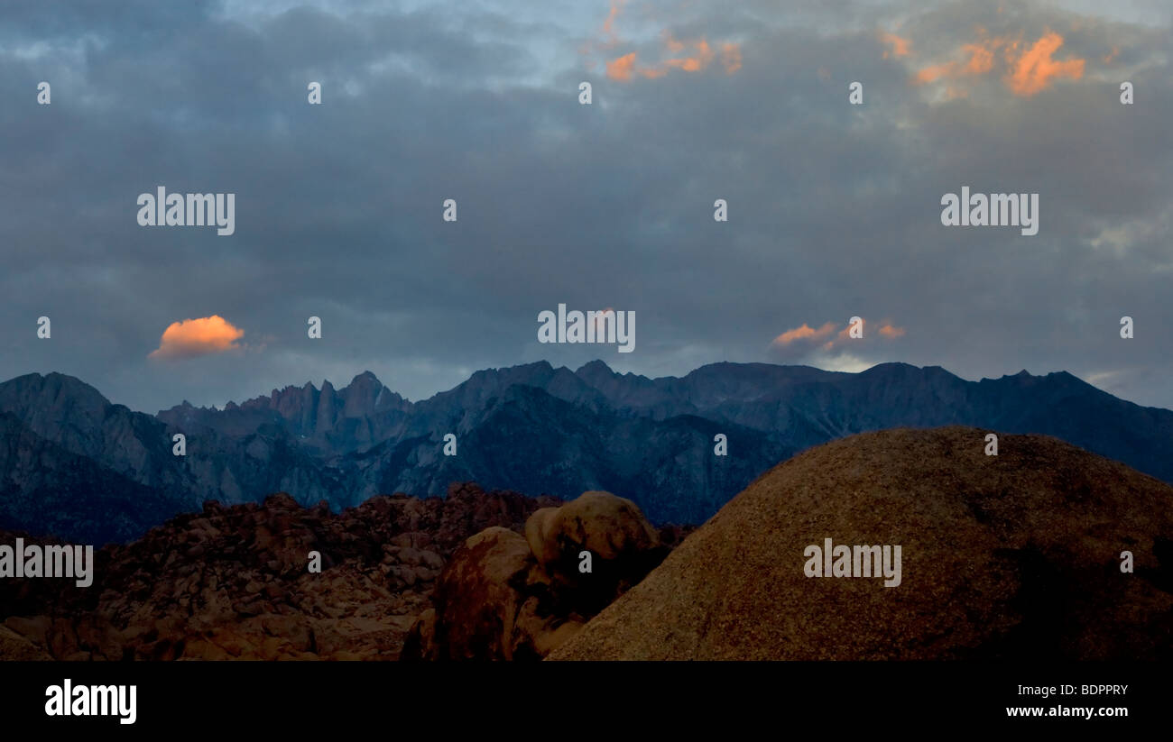 A dawn sky begins to warm over Mt. Whitney as seen from the Alabama Hills near Lone Pine, California, USA. Stock Photo