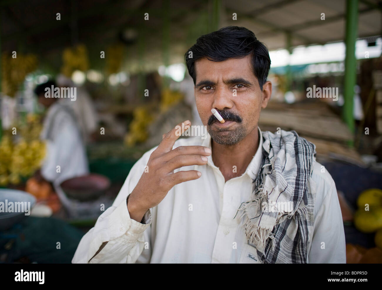 Smoking man at the Itwar Bazar in Islamabad , Stock Photo
