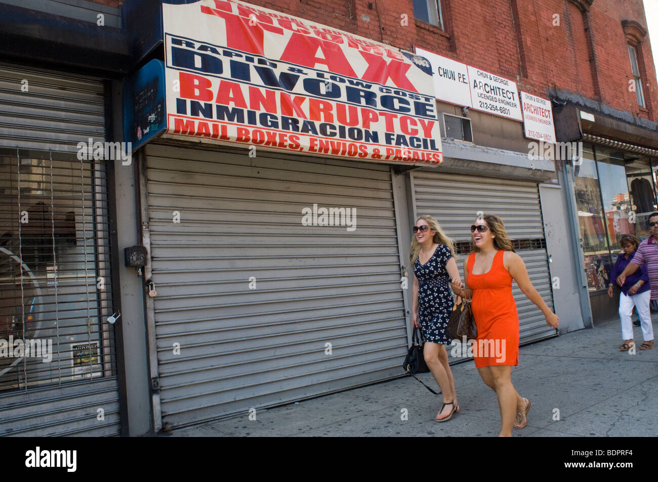 A local financial and immigration services business in the Lower East Side neighborhood of New York Stock Photo
