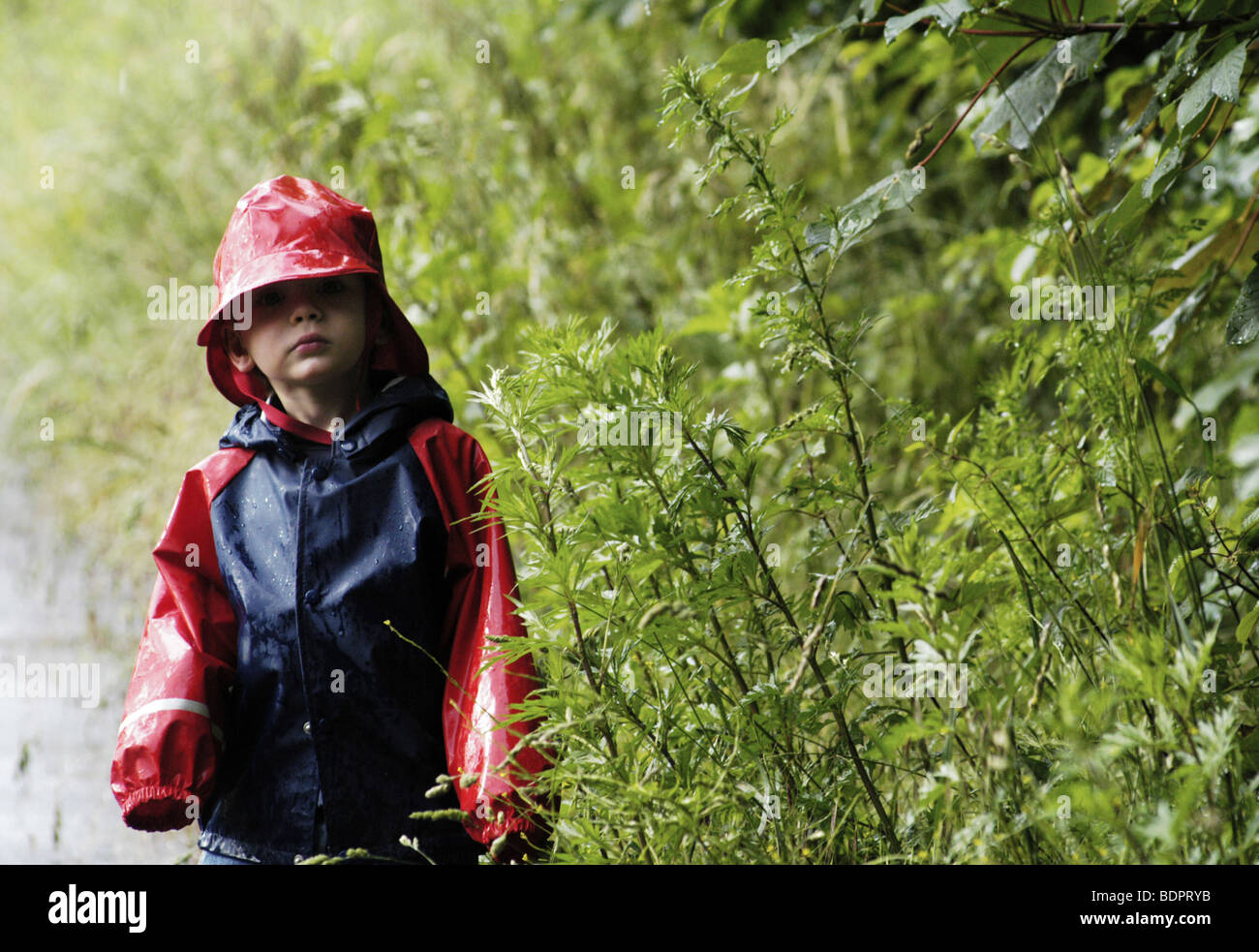 Boy with raincoat and hat Stock Photo Alamy