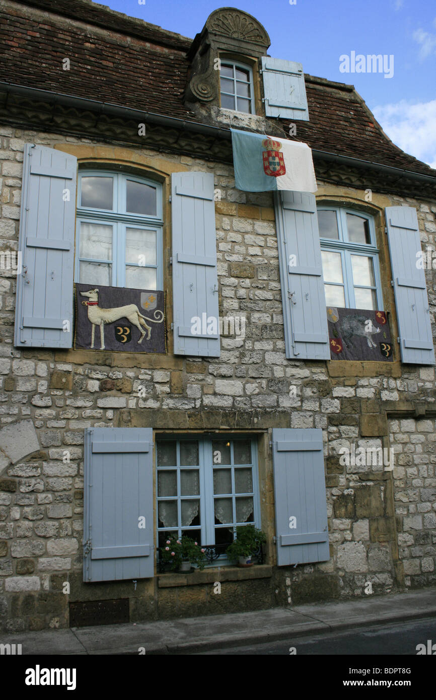 House with blue shutters in the bastide of Monpazier, Dordogne Stock Photo