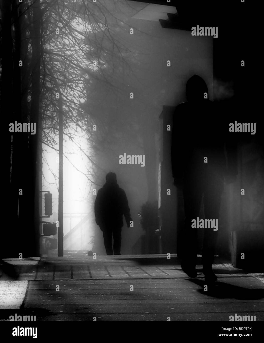 Silhouette man walking down street hi-res stock photography and images ...