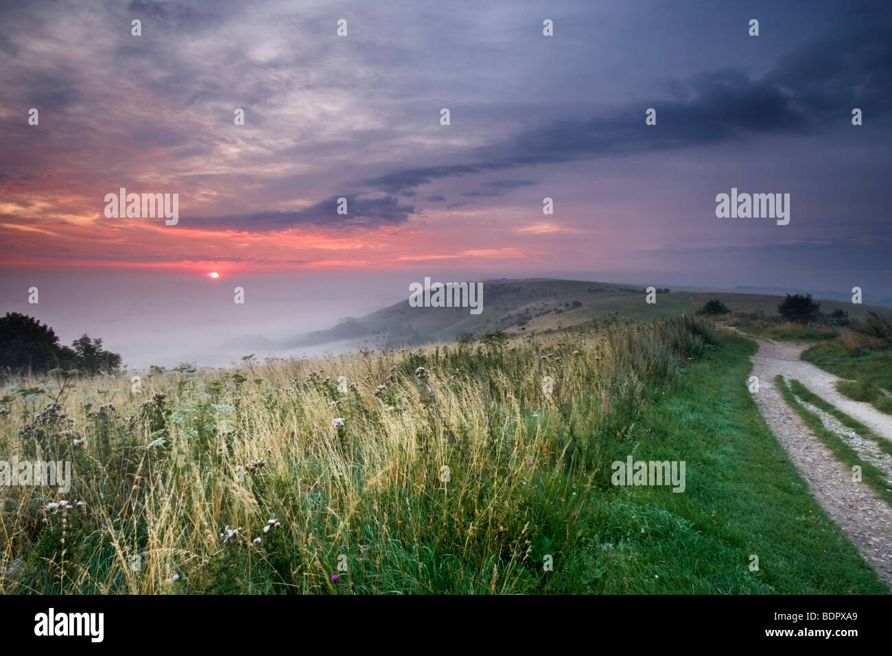 Sun rising over Ditchling Beacon in Aug 09 Stock Photo