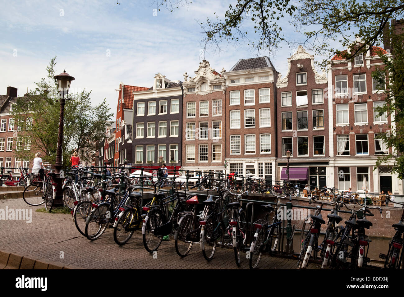 Amsterdam: bicycles parked by a canal. Holland Stock Photo