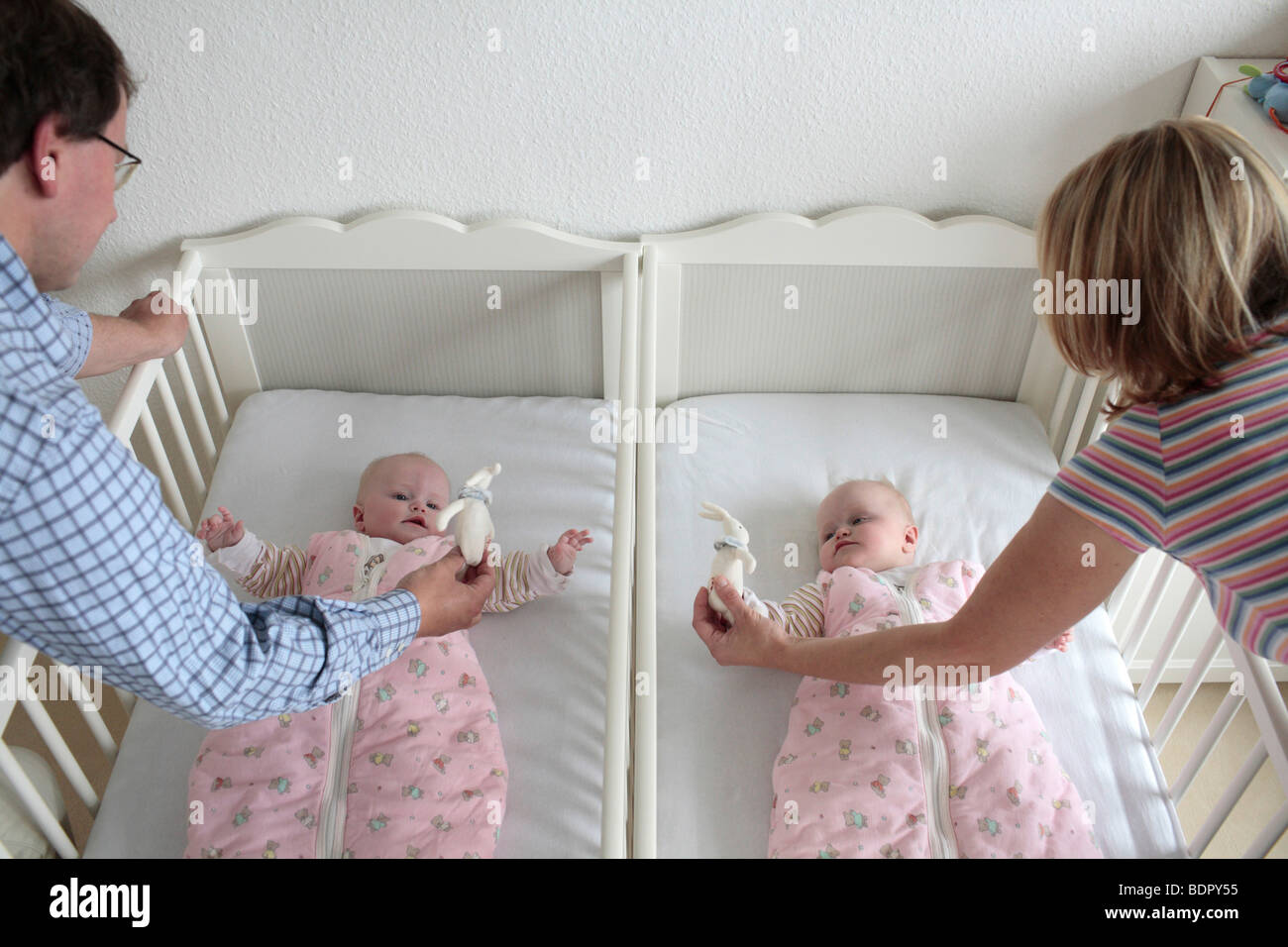 Parents with twins, 6 month old. Stock Photo