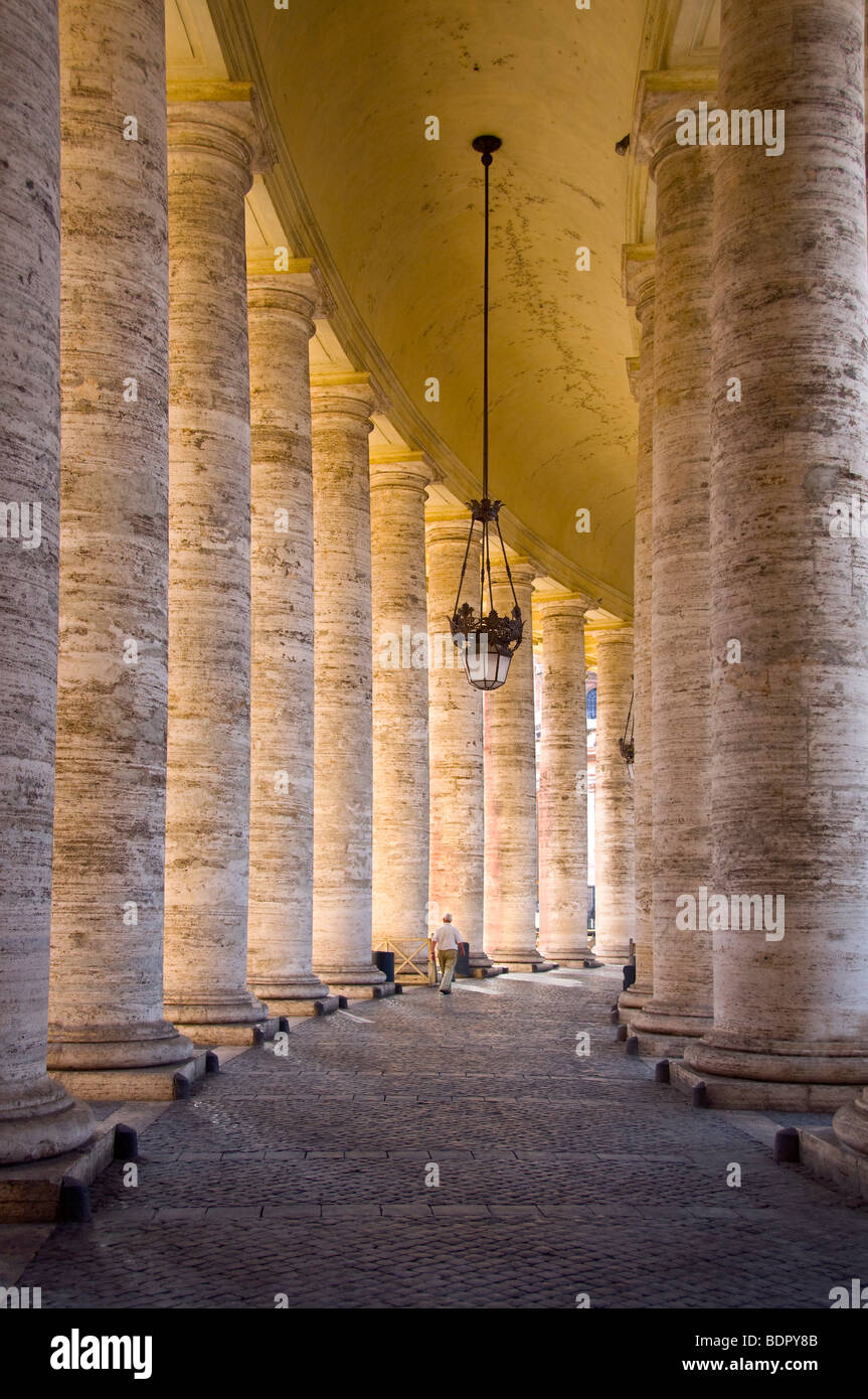 Man in colonnade Stock Photo