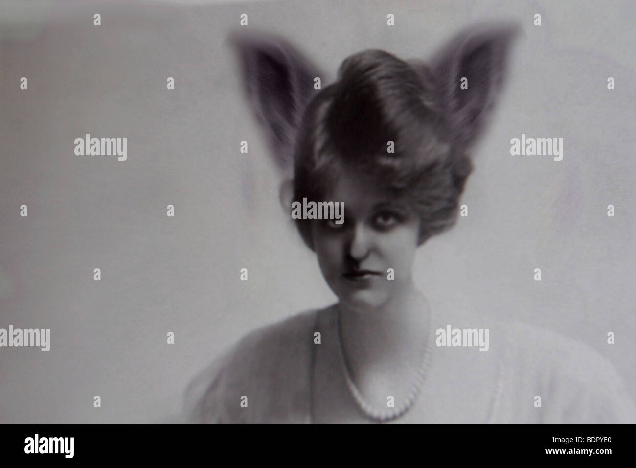 A womans face with strange hairdo Stock Photo