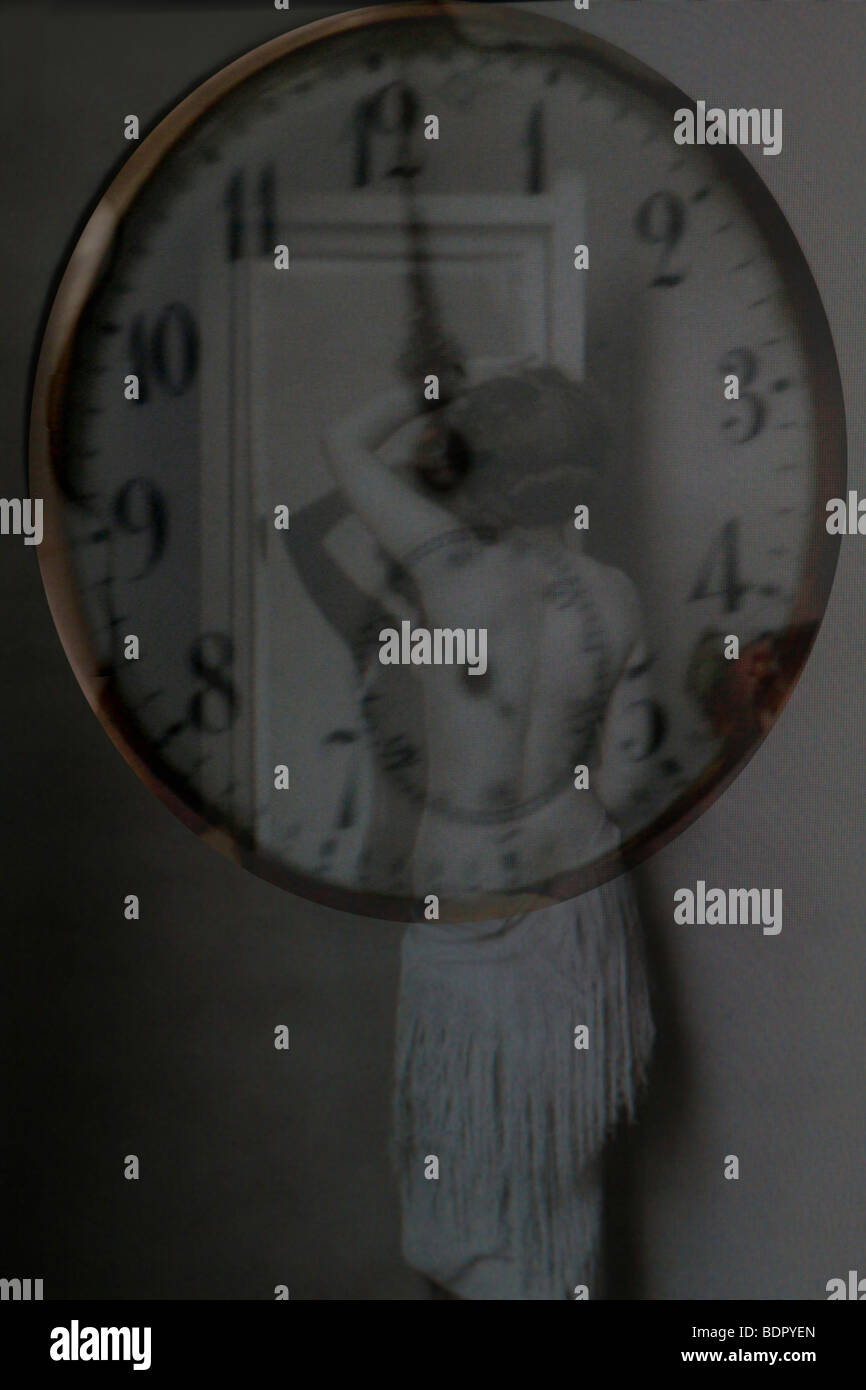 A woman behind a clock Stock Photo Alamy