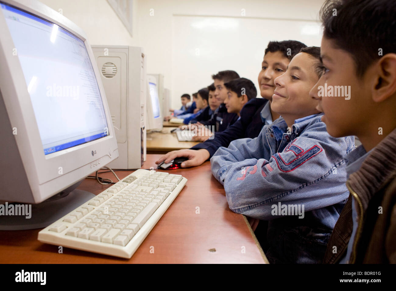 Students using computer at school. Stock Photo