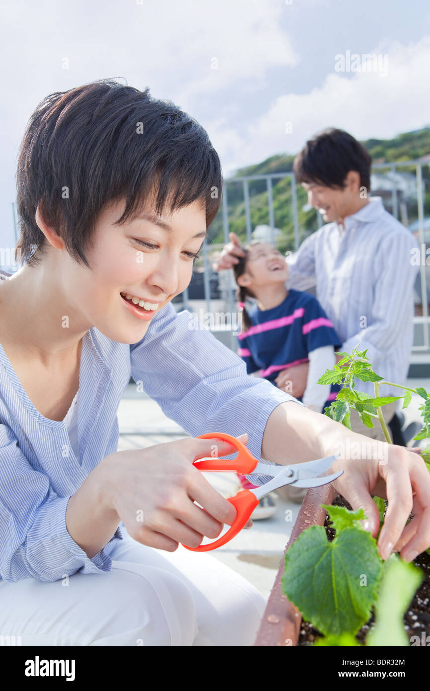 Parents and daughter relaxing on veranda Stock Photo