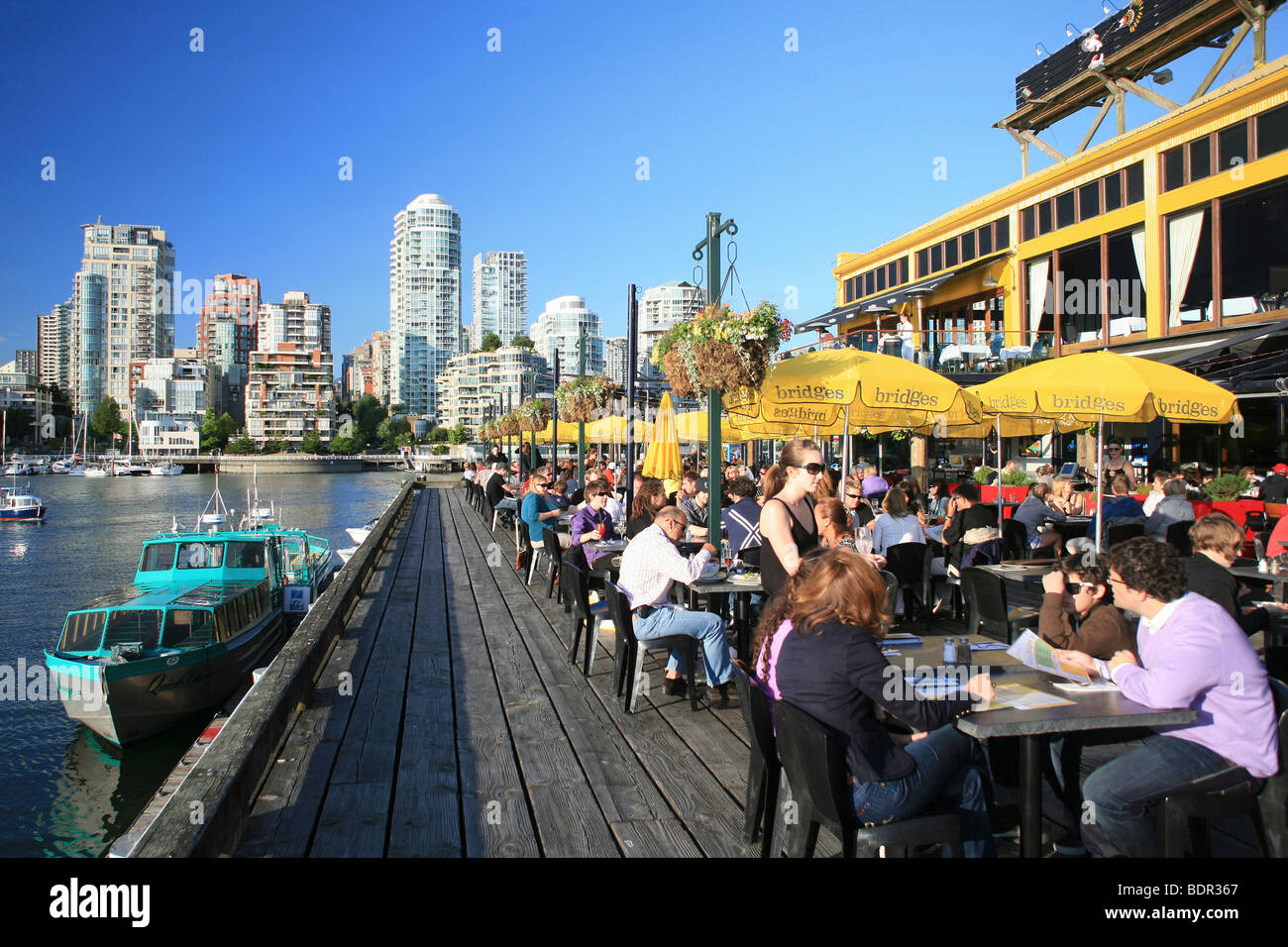 Restaurant in Granville Island and Vancouver Skyline Stock Photo