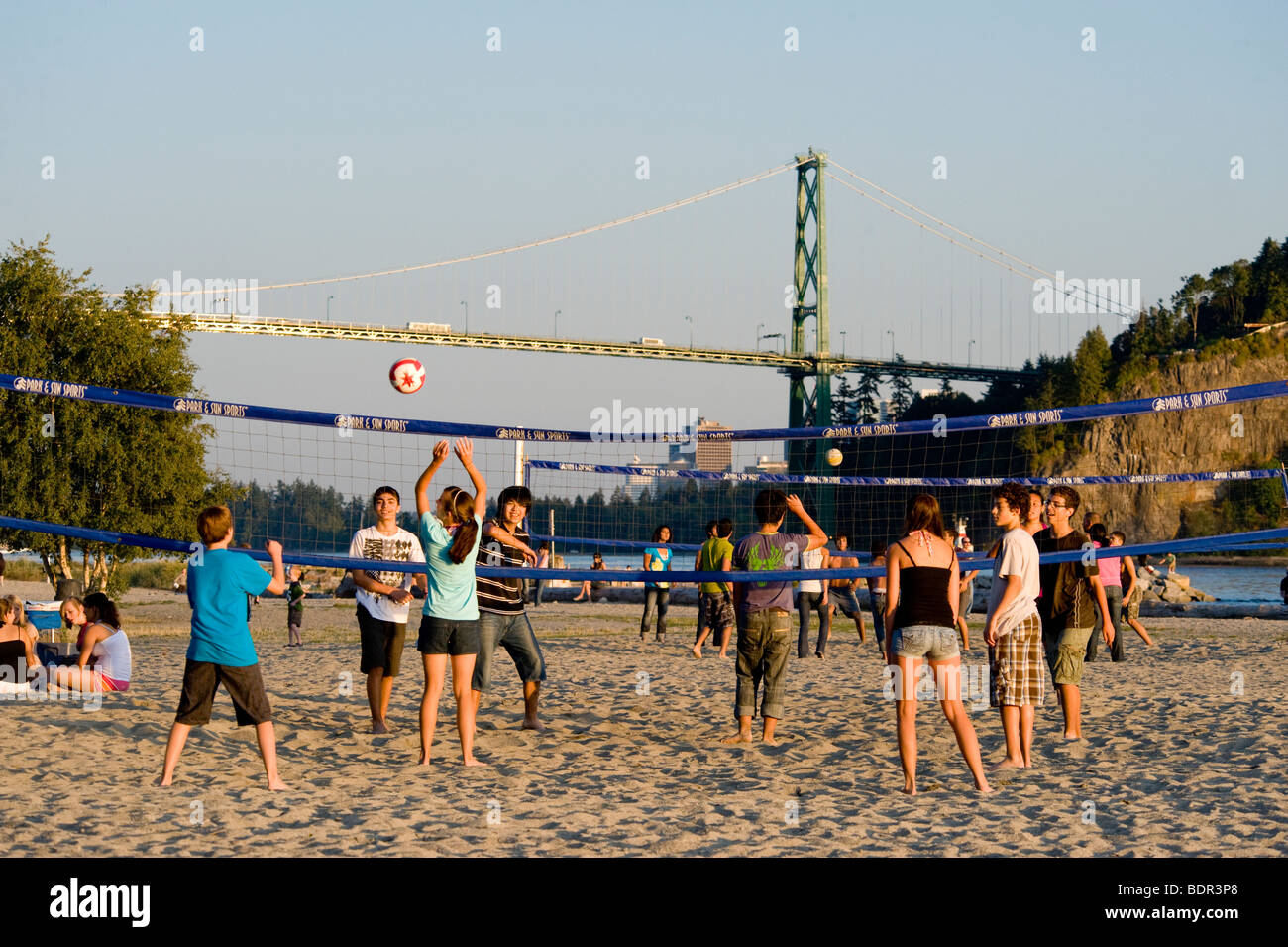 Volleyball on Ambleside Beach backdropped by the Lions Gate Bridge