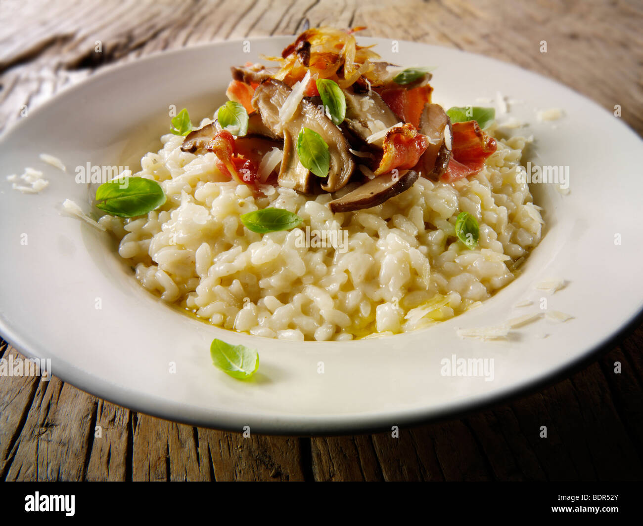 Classic risotto with wild porcini mushrooms and bacon Stock Photo Alamy