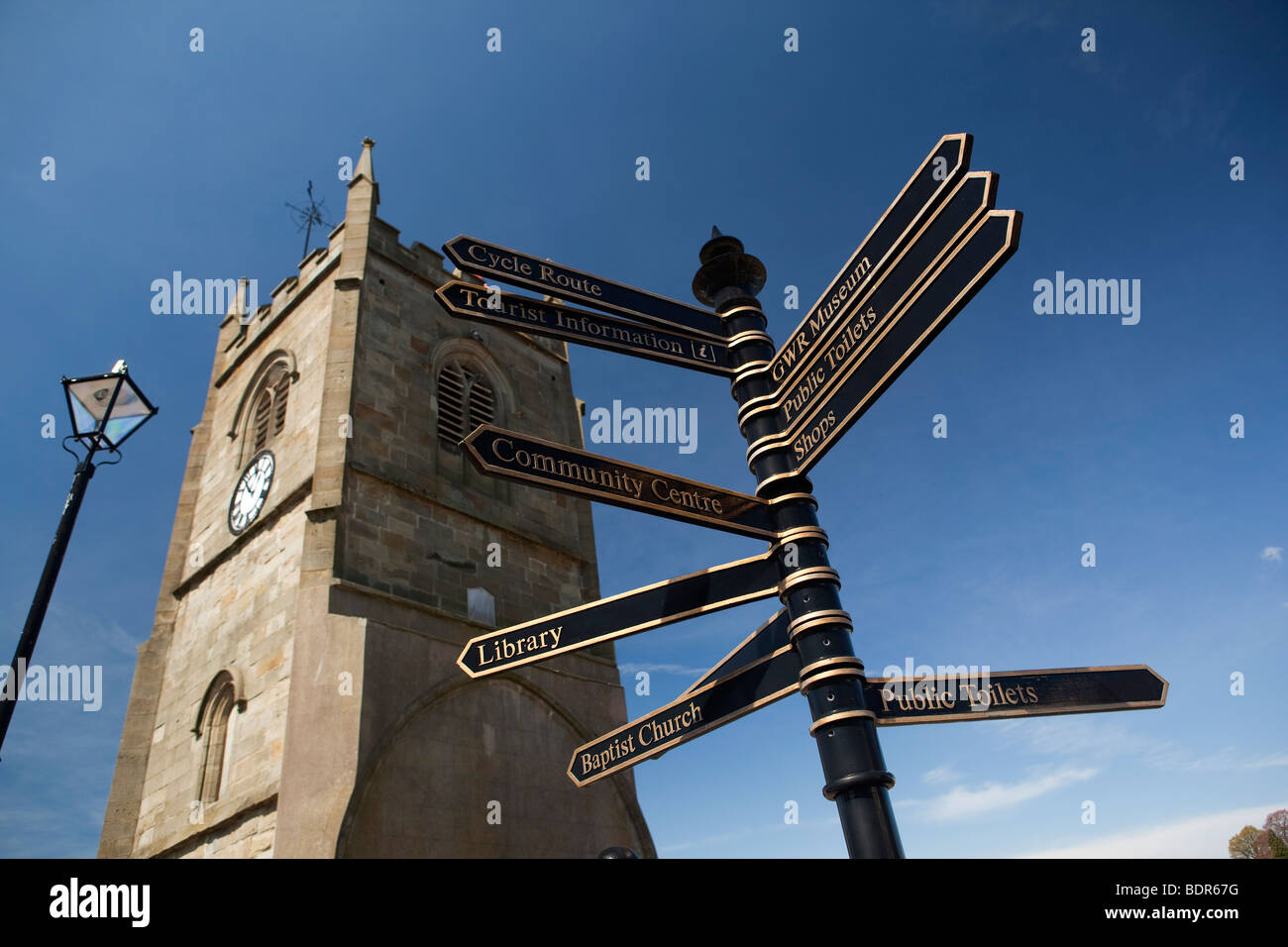 UK, Gloucestershire, Forest of Dean, Coleford, clock tower of former parish church, tourist information sign Stock Photo