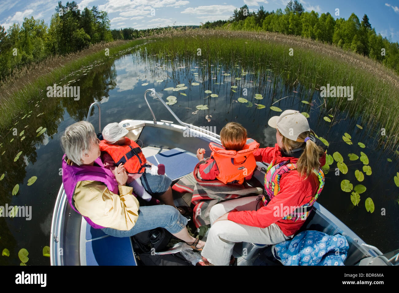 Two women and children in a boat Sweden. Stock Photo