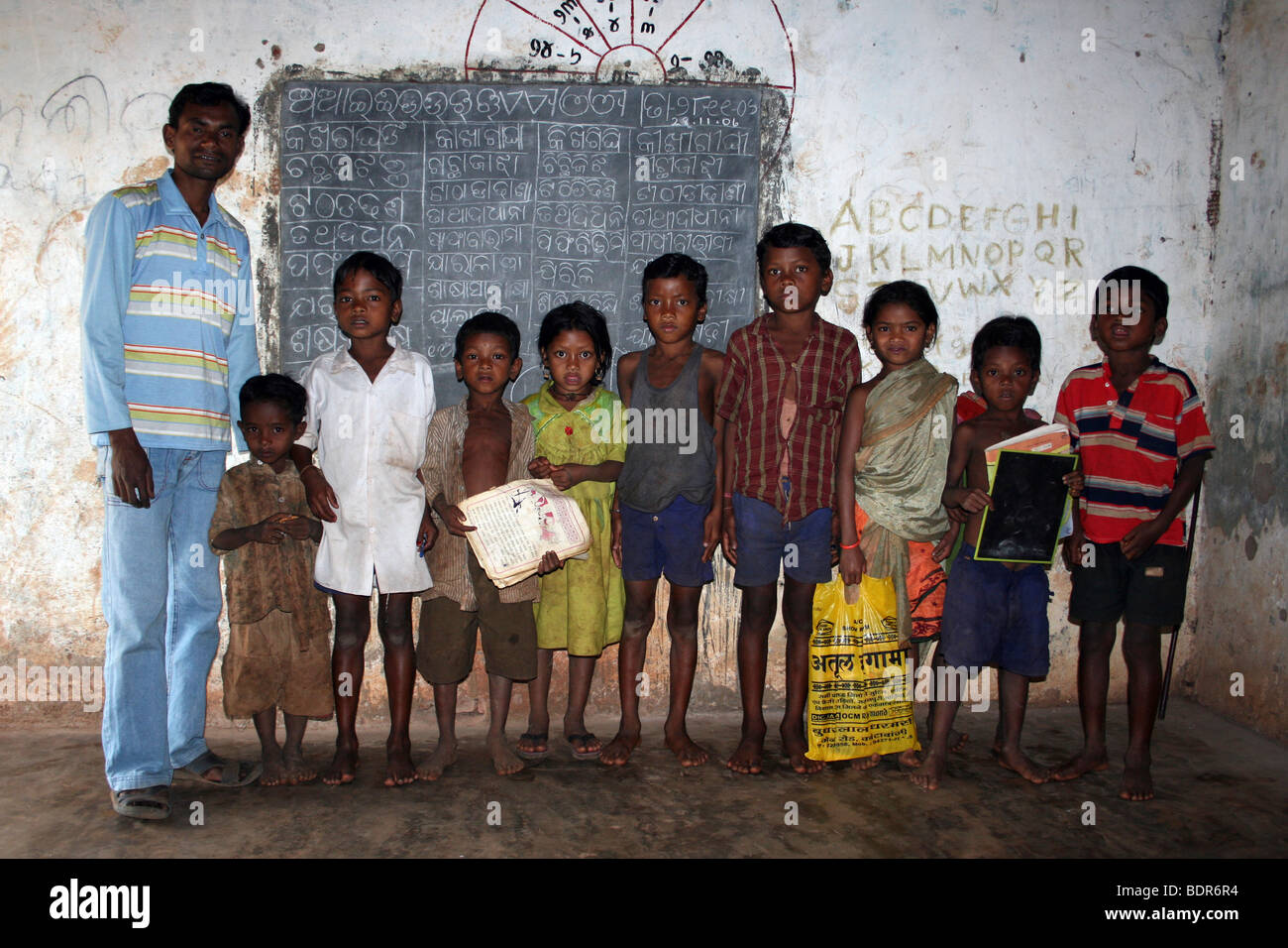 Schoolchildren With Their Teacher In The Classroom Of A Typical Rural