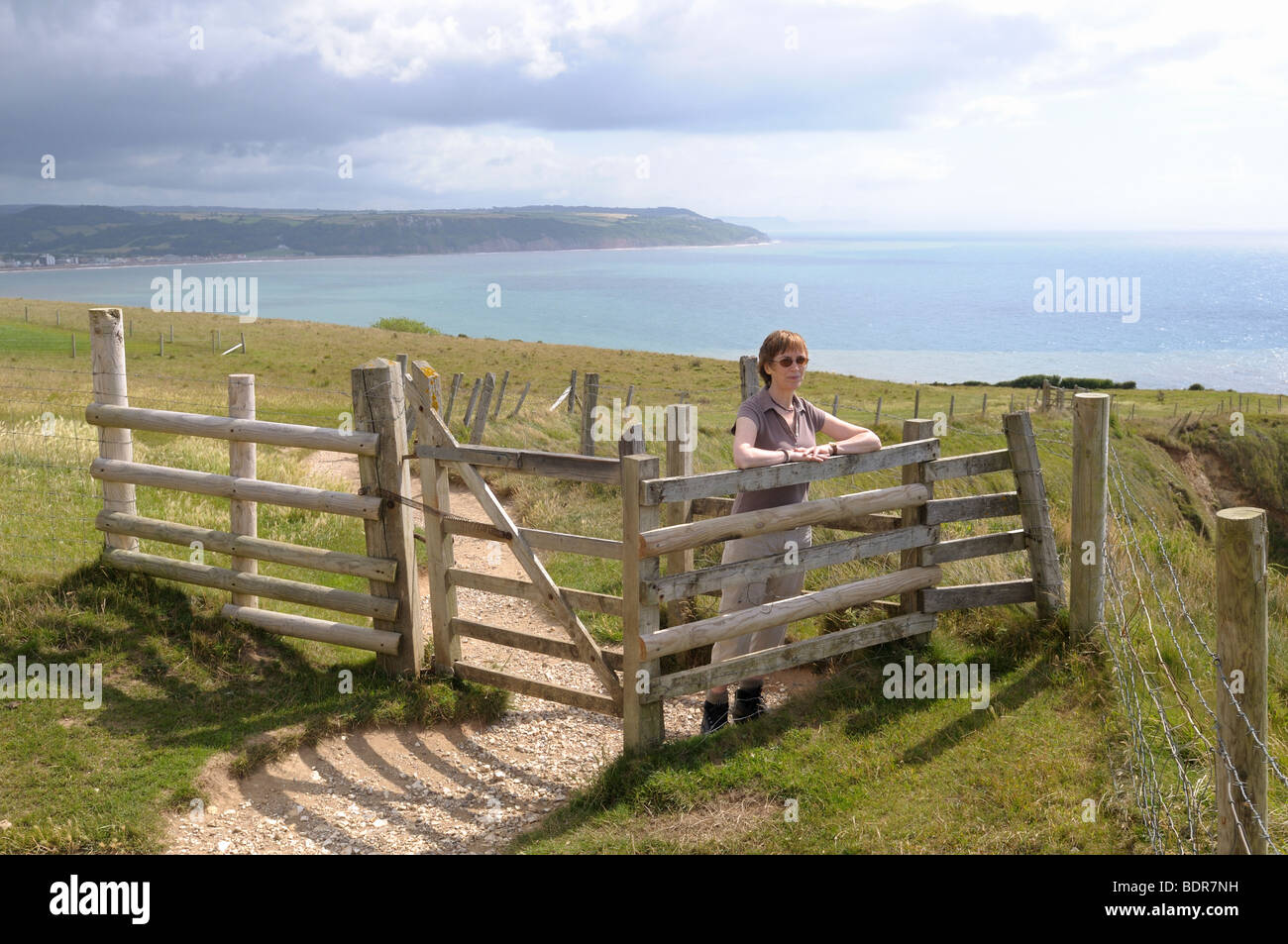 Walker on the South West Coast Path at Beer Devon England Stock Photo