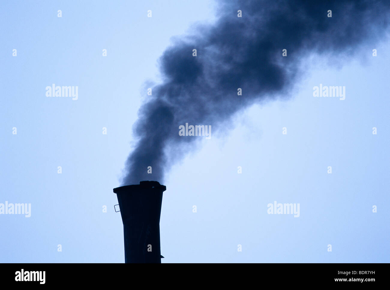 Smoke and a chimney stack in the coal industry, Svalbard. Stock Photo