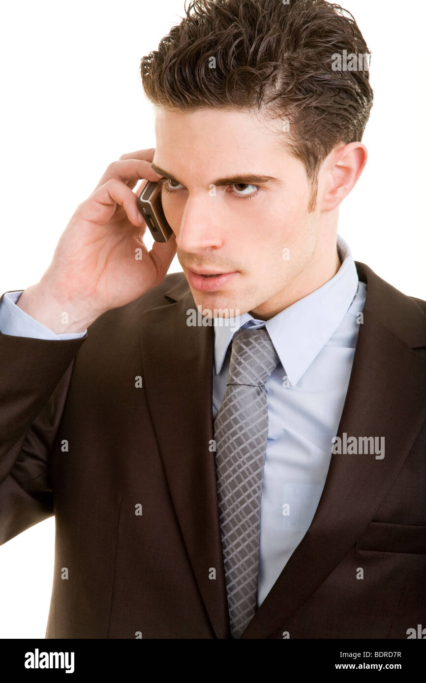 Junger Mann im Anzug telefoniert leicht ver rgert mit seinem Handy Stock Photo