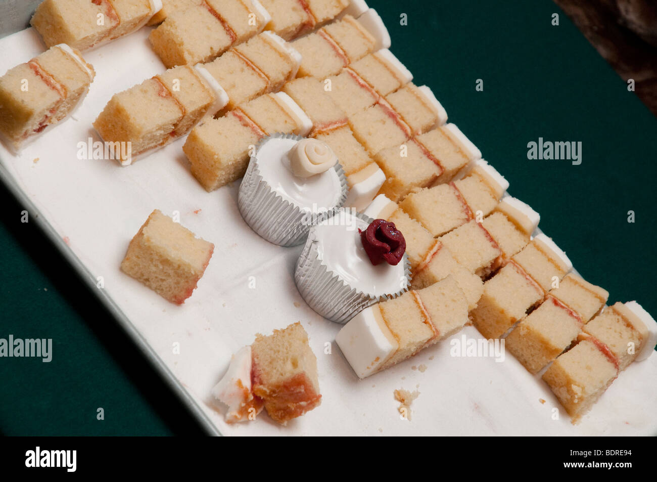 Slices Of Wedding Cake Served On A Tray With Two Silver Foiled