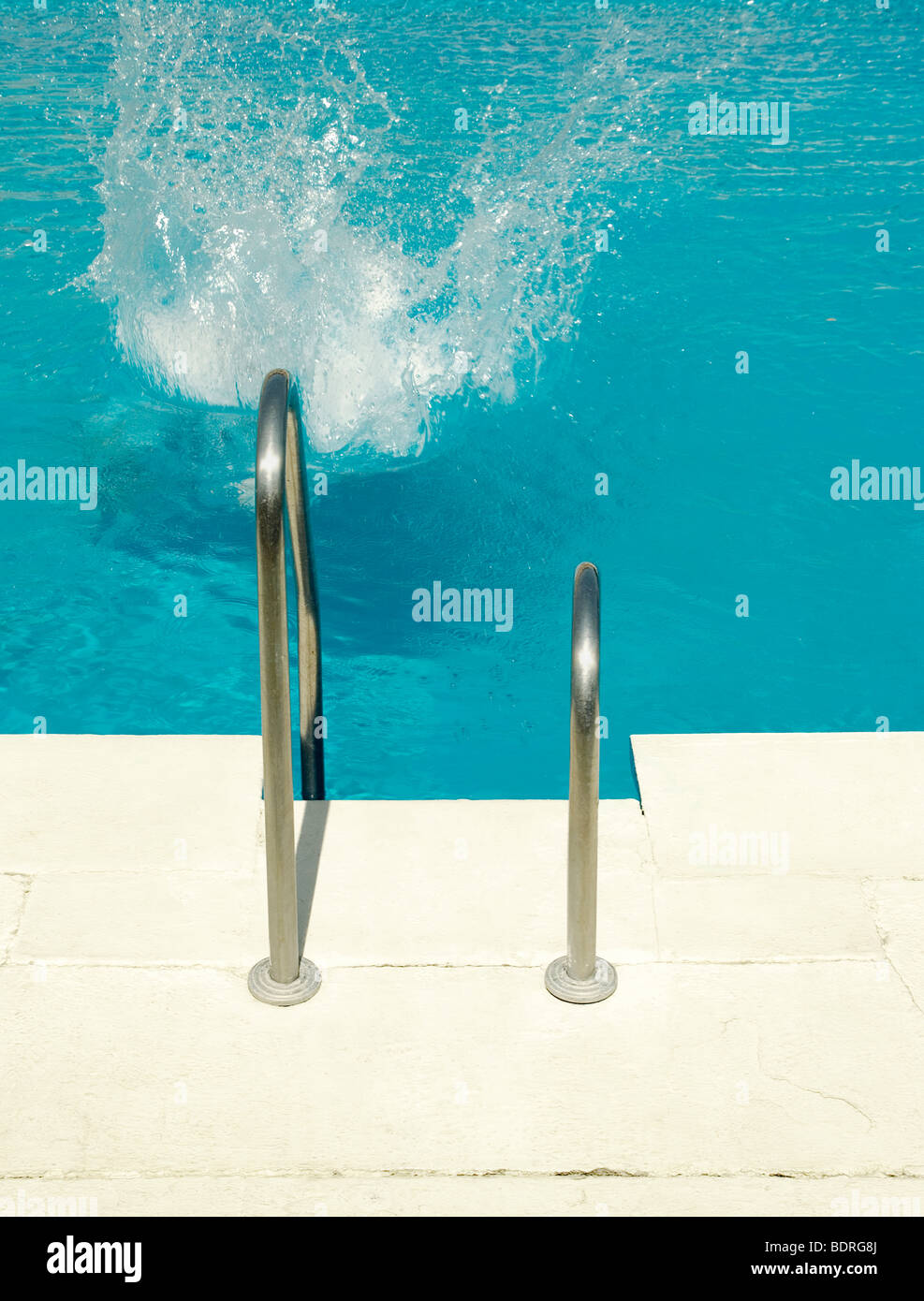 Swimmer jumps into a swimming pool Stock Photo Alamy