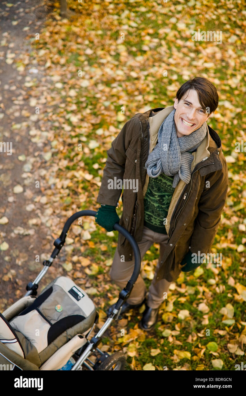 Father and preambulator Stock Photo