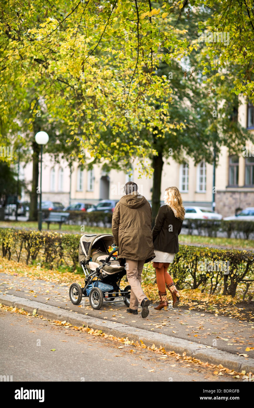 A couple taking a walk with their son Stock Photo