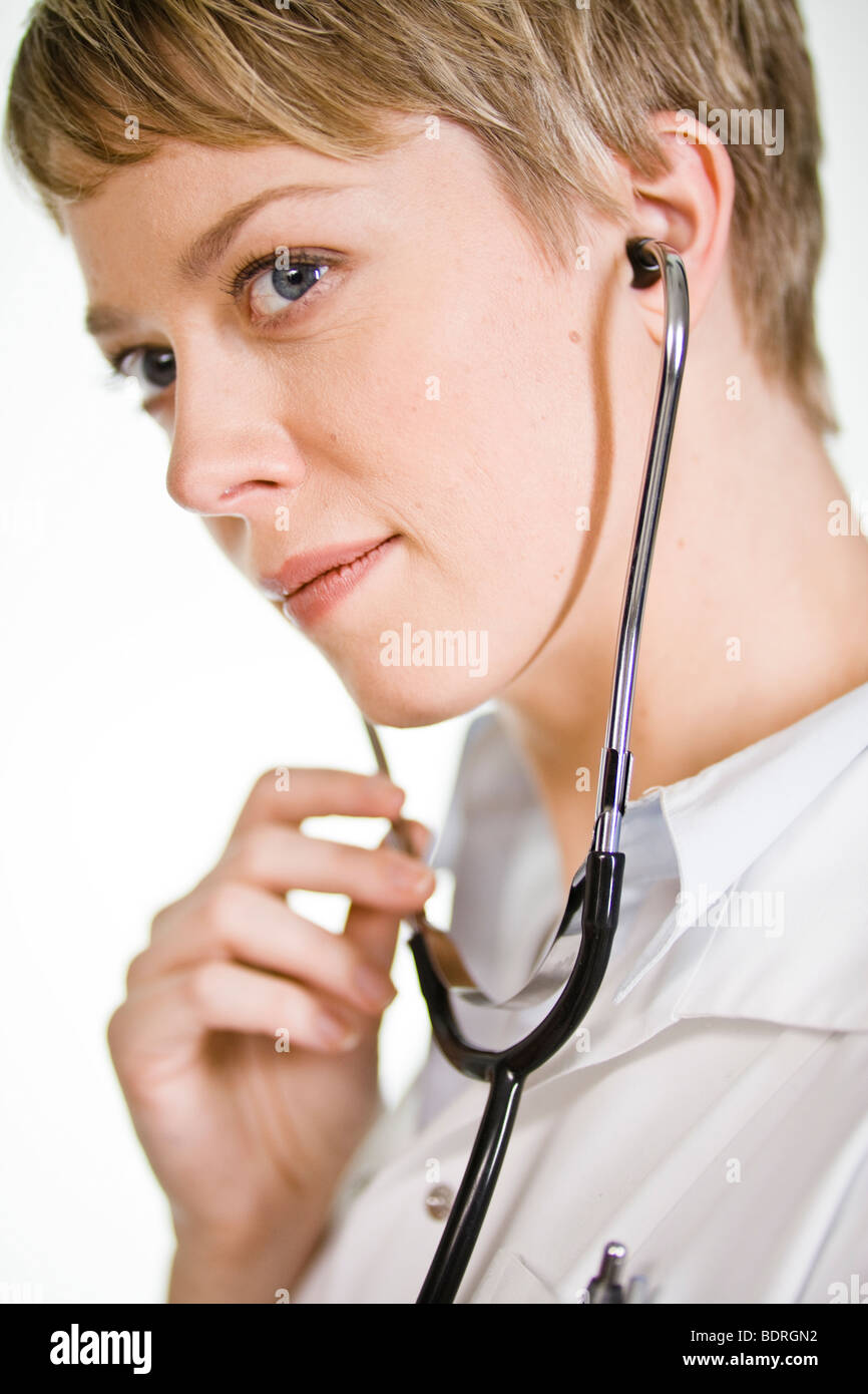 A female doctor using a stethoscope Stock Photo - Alamy