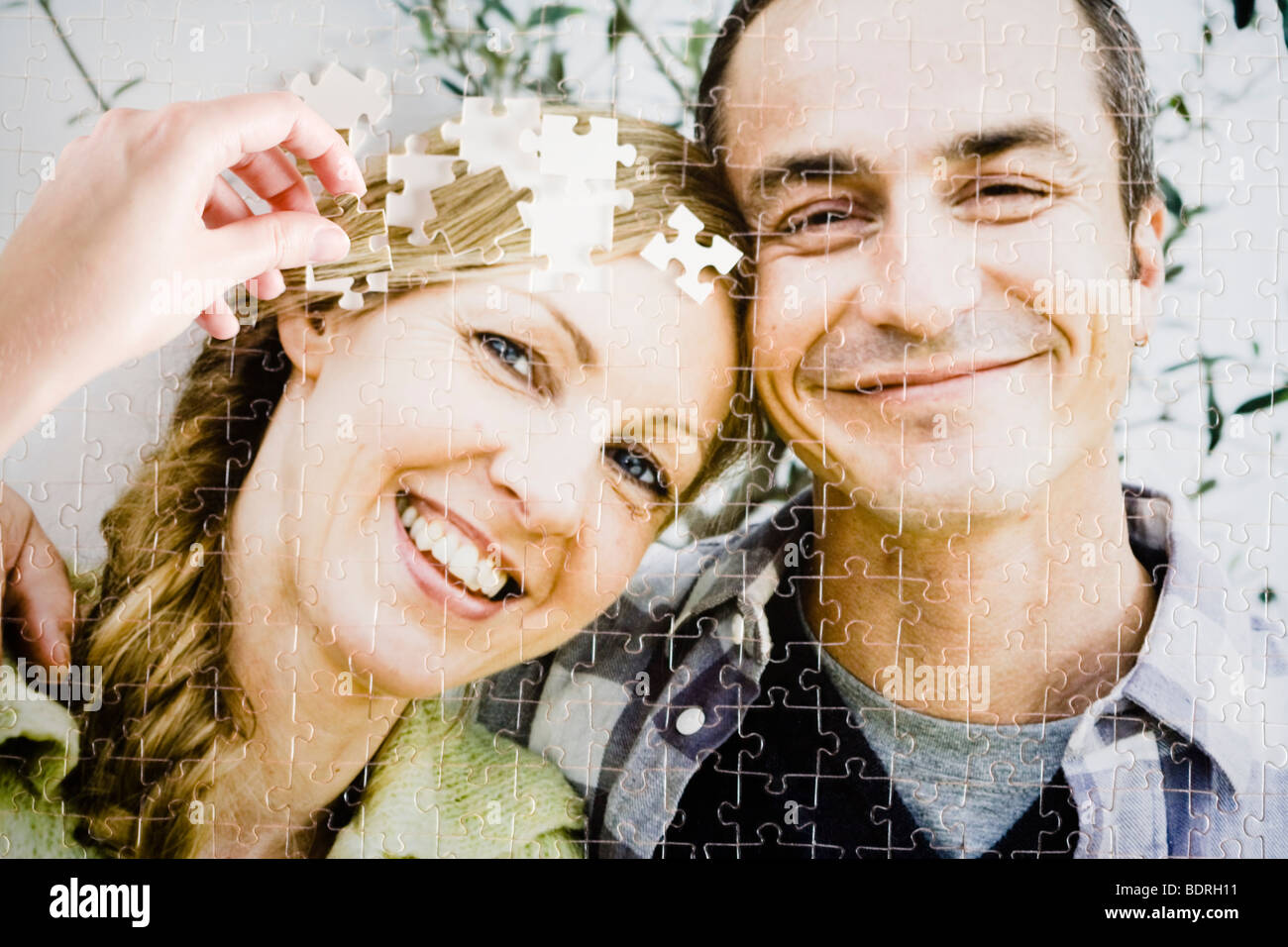 A puzzle with the image of a couple Stock Photo - Alamy