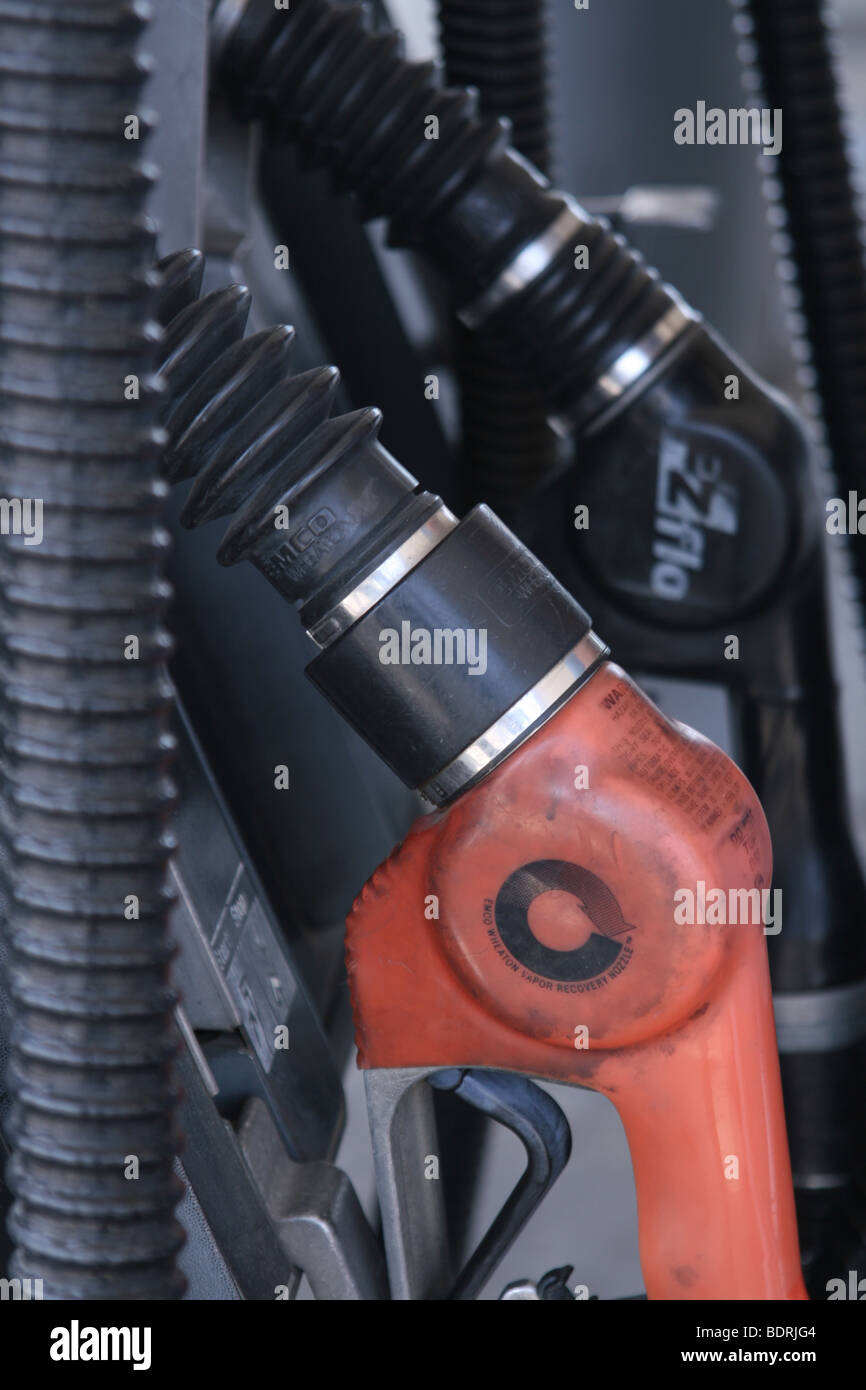 Petrol Gas Pump Nozzles at a Service Station Stock Photo