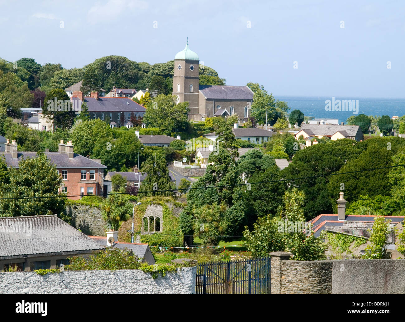 A view of houses on the hillside out towards the sea in the town of Wicklow, County Wicklow Ireland Stock Photo