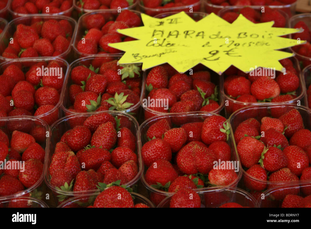 Punets of strawberries sold at the weekly market in Lectoure, Gers Stock Photo