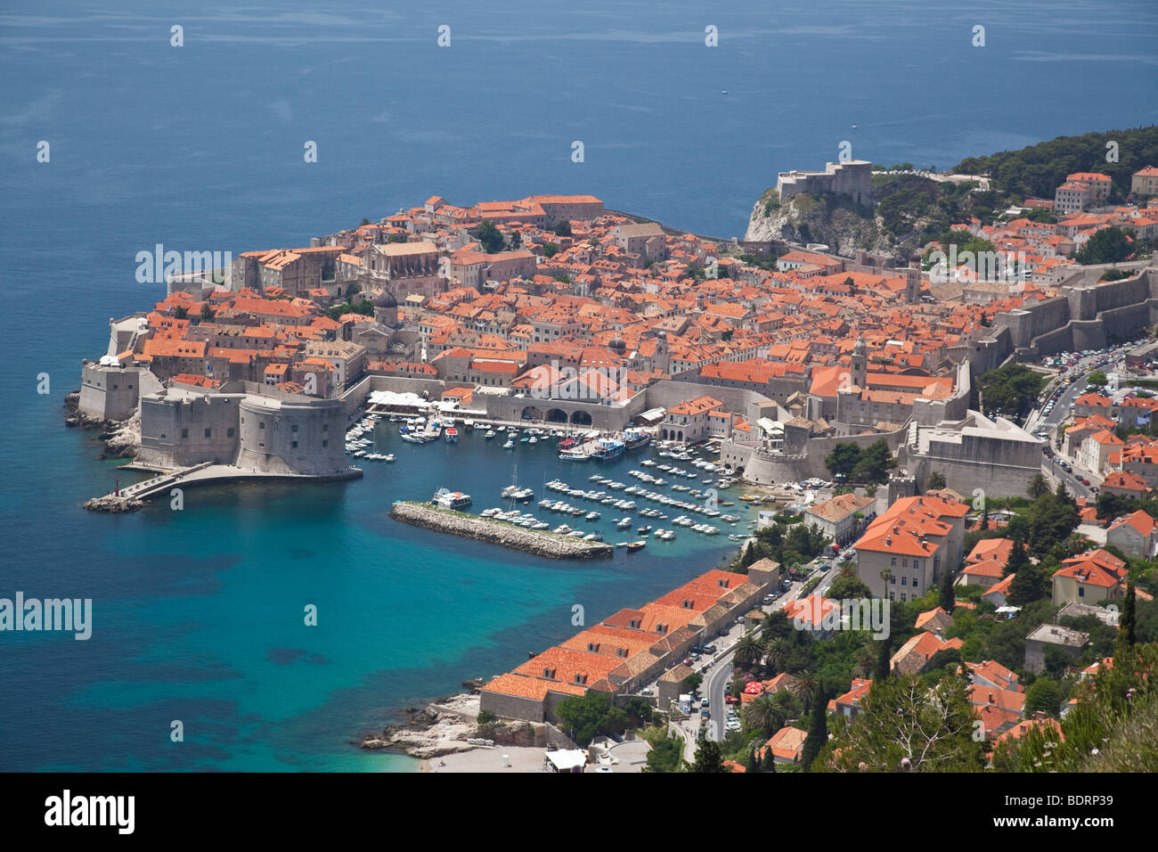 The Old Town of Dubrovnik in Croatia with the harbor and marina and looking across the roof tops of  the old town Stock Photo