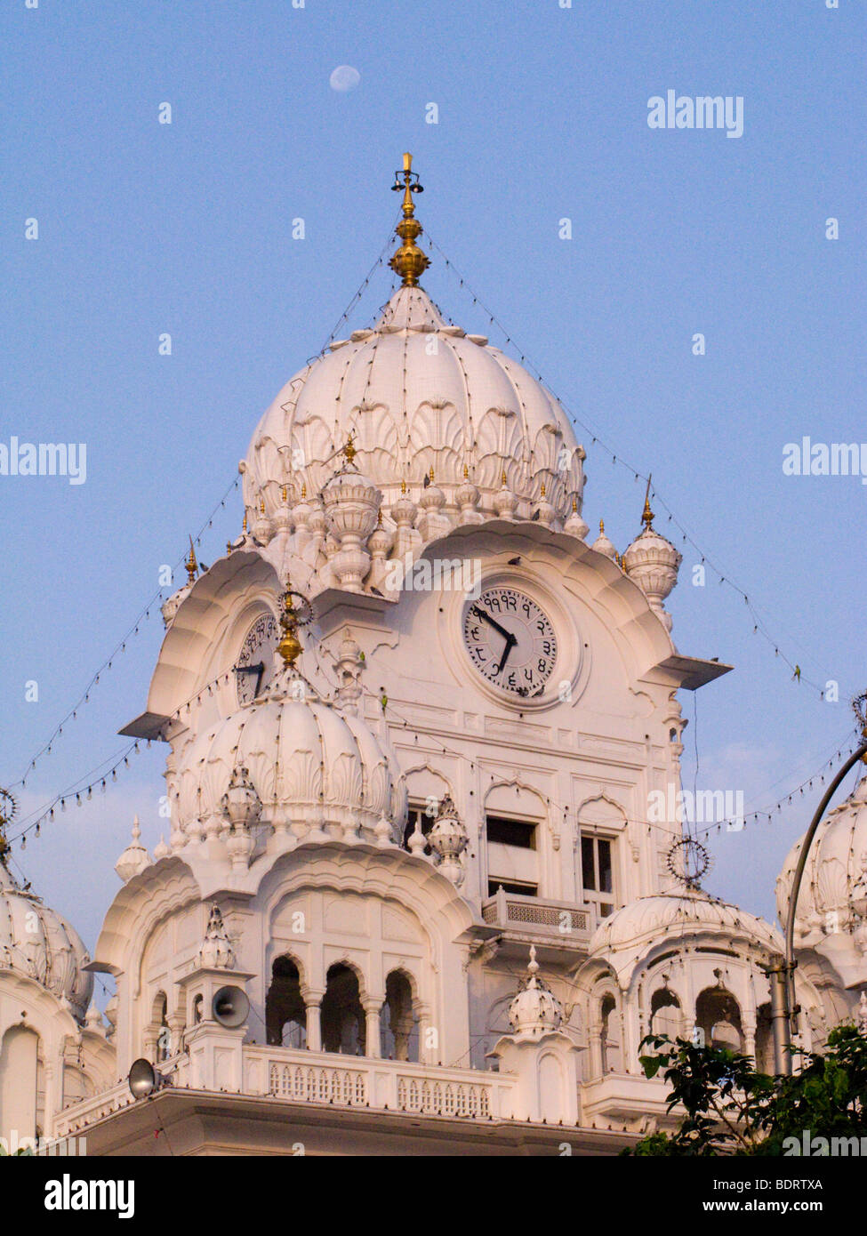 Clock tower and clock at the Golden Temple (Sri Harmandir Sahib) at Amritsar. Punjab. India