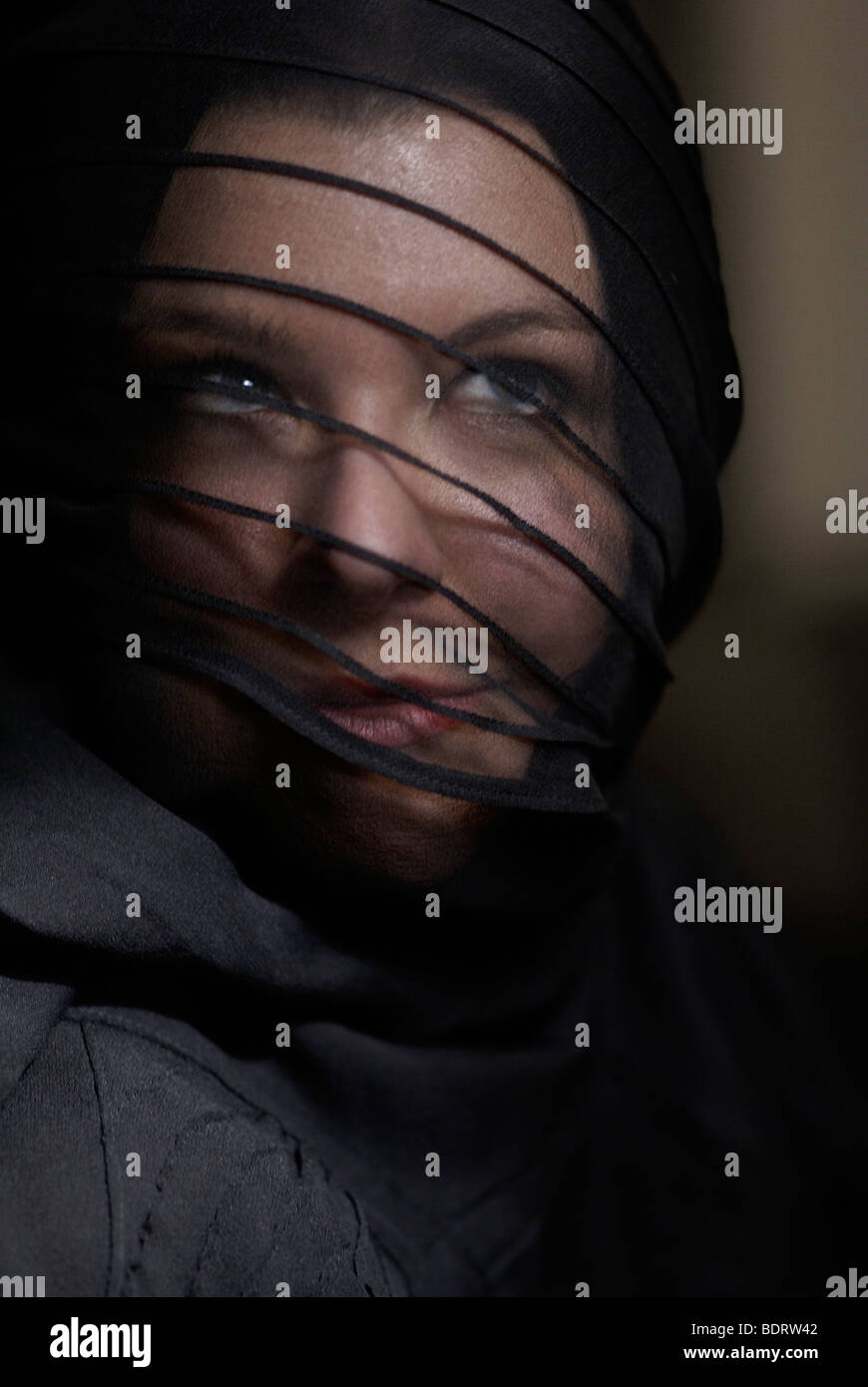 Young woman wearing black and a veil, portrait Stock Photo - Alamy