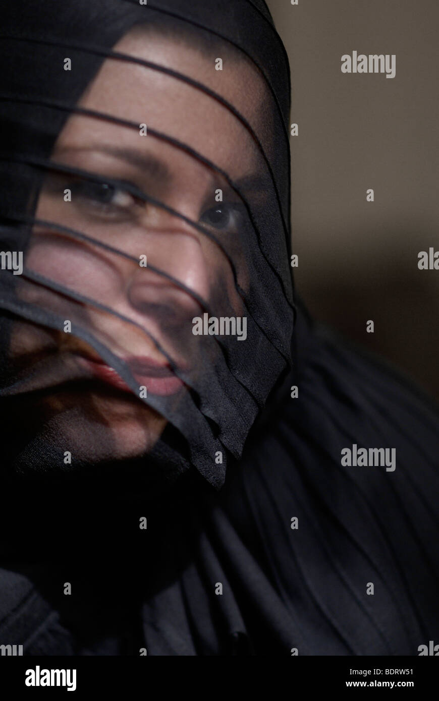Young woman wearing black and a veil, portrait Stock Photo - Alamy