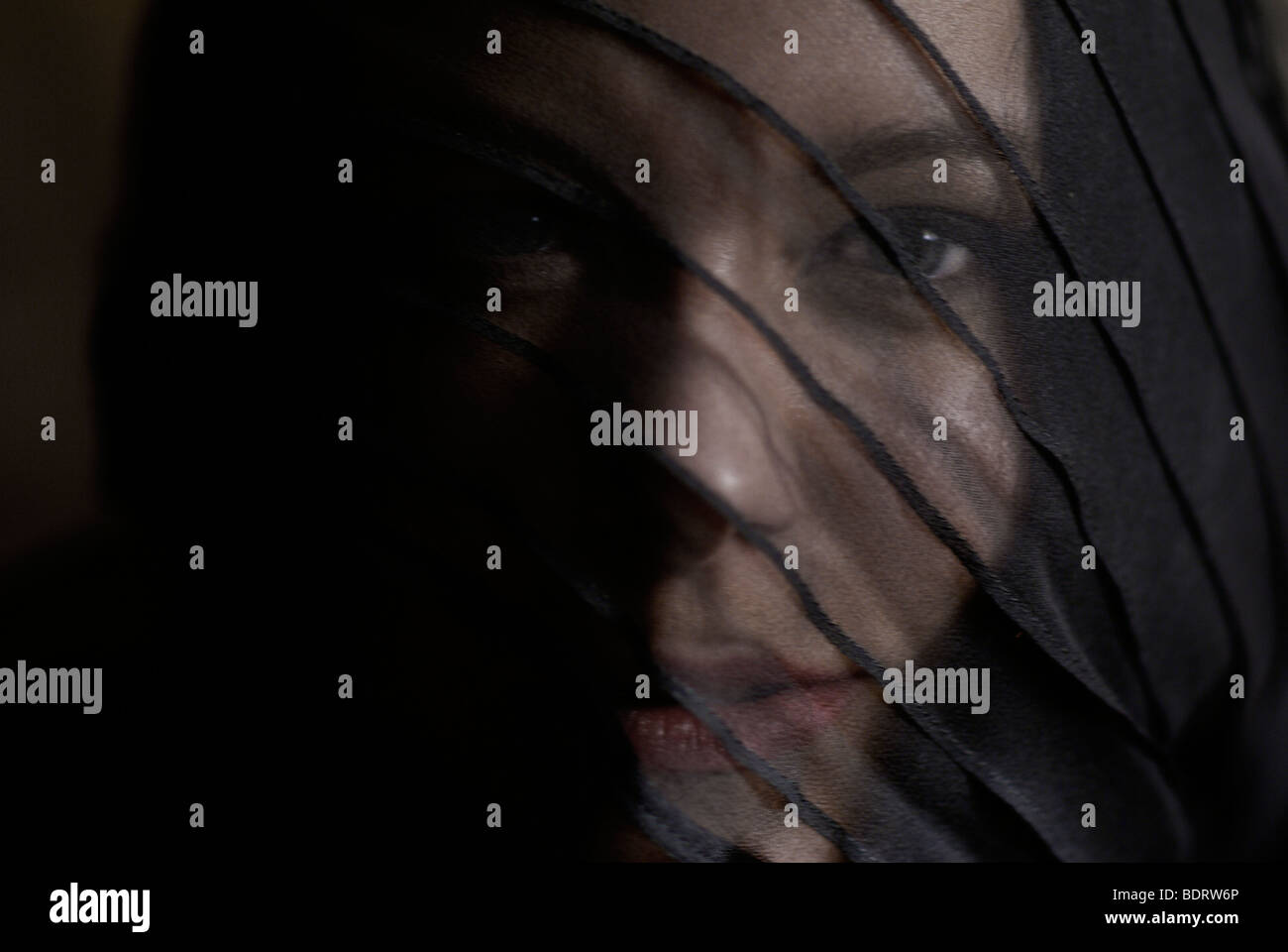 Young woman wearing black and a veil, portrait Stock Photo - Alamy