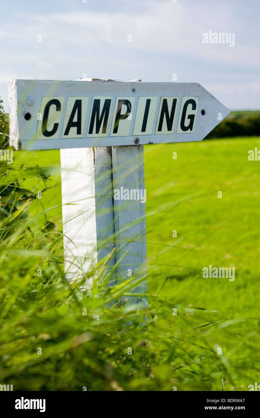 Wooden campsite direction sign Stock Photo