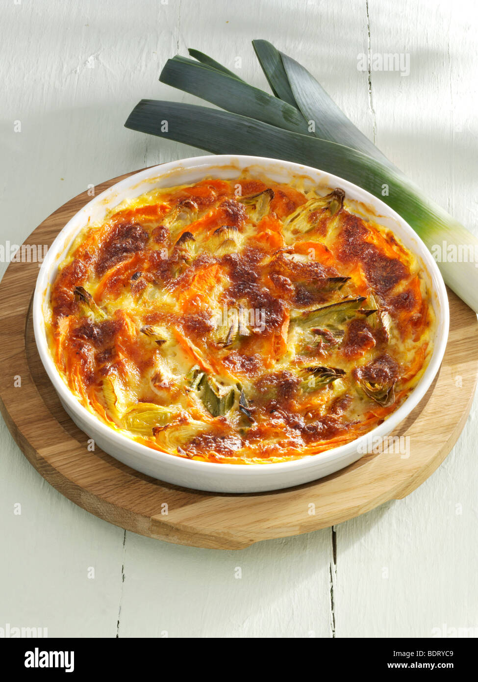 Carrot and leek casserole in a baking dish with leek Stock Photo