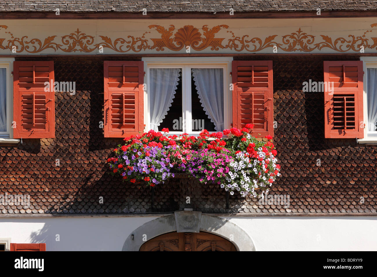 Window with flowers, Bregenzerwald house, Schwarzenberg, Bregenz Forest, Bregenzerwald, Vorarlberg, Austria, Europe Stock Photo