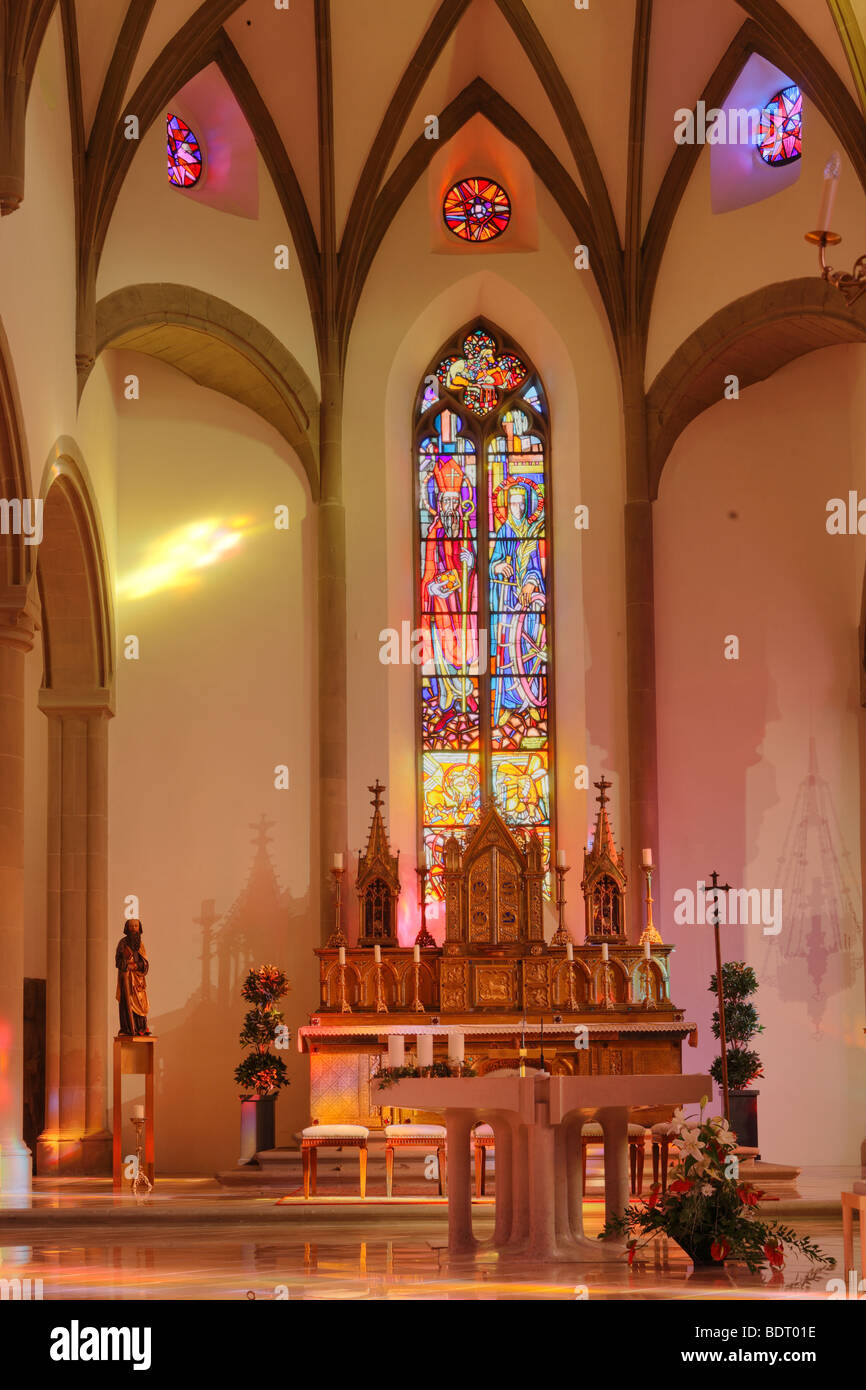 Main altar and stained-glass window in St. Nicholas Cathedral, Feldkirch, Vorarlberg, Austria, Europe Stock Photo
